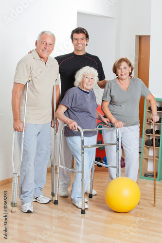 Photo: Portrait Of Disabled Senior People With Trainer Portrait Of Disabled Senior People With Trainer
