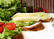 sandwiches with cheese slices, tomato, bacon and salad sandwiches with cheese slices, tomato, bacon and salad