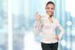 Business women in modern glass interior