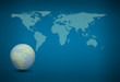 World map and earth globes by cork board on blue background