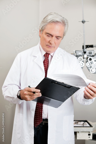 Photo: Optometrist Checking the Prescription Optometrist Checking the Prescription