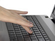 Woman typing on notebook