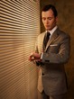 Retro businessman looking at his watch