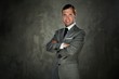 Happy man in grey suit