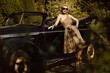 Woman near a retro car outdoors