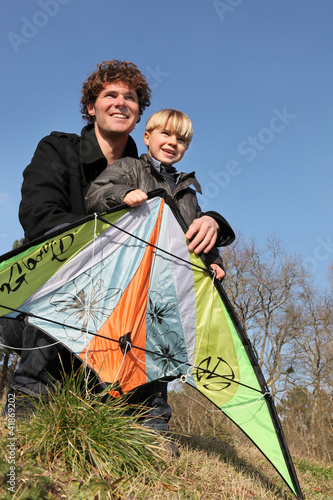 Photo: Father and son with a kite Father and son with a kite