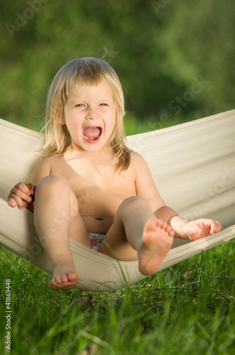 Photo: Adorable baby swing sitting in hammock Adorable baby swing sitting in hammock