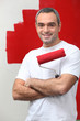 man happy to paint his wall