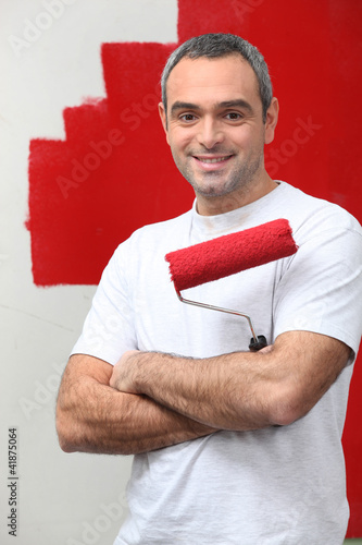 Photo: man happy to paint his wall man happy to paint his wall