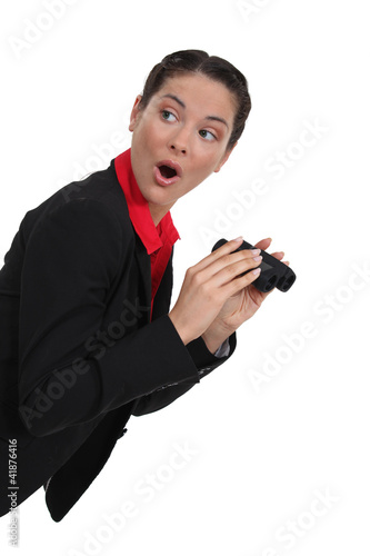 Photo: Shocked woman with a pair of binoculars Shocked woman with a pair of binoculars