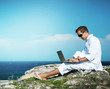 Photo: Young Man with Laptop Outdoor Young Man with Laptop Outdoor