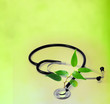 natural medicine stethoscope and plant concept