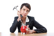 Woman and piggybank on white