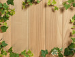 An Ivy plant on a table of hardwood