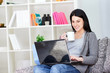 smiling woman with laptop drinking coffee smiling woman with laptop drinking coffee