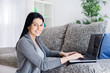 Woman working with computer at home Woman working with computer at home