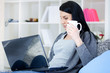 Woman in a sofa with laptop Woman in a sofa with laptop