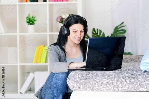 Photo: girl spending time on laptop computer girl spending time on laptop computer
