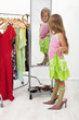 Little girl trying on large shoes