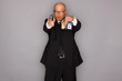 FBI Agent with gun and holding a badge.