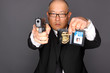FBI Agent with gun and holding a badge.