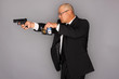 FBI Agent with gun and holding a badge.
