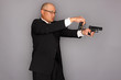 FBI Agent with gun and holding a badge.