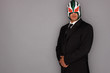 Man wearing a suit and luchador mask.