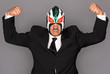 Man wearing a suit and luchador mask.