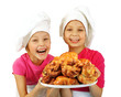 Two funny happy bakers holding plate with rolls