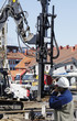 heavy building machinery and workers