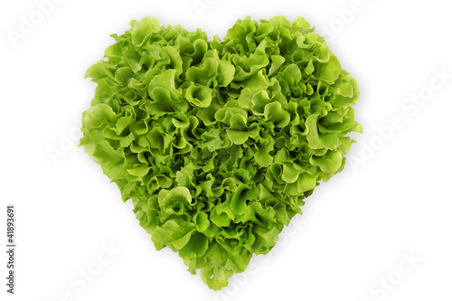Photo: heart-shaped salad, lettuce on white background heart-shaped salad, lettuce on white background