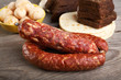 Still-life with sausage and bread on a table Still-life with sausage and bread on a table
