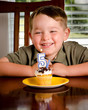 Young boy blowing out his birthday candle Young boy blowing out his birthday candle