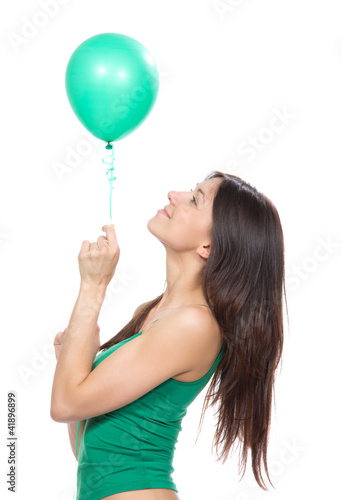 Photo: Young happy girl with green balloon Young happy girl with green balloon