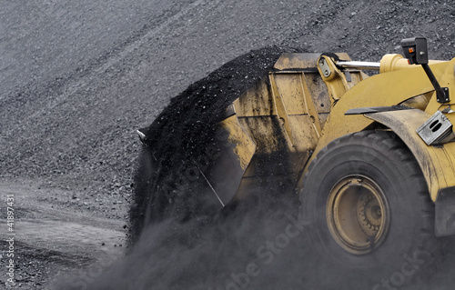 Photo: Excavator in coals. Excavator in coals.