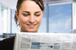 Woman reading a newspaper