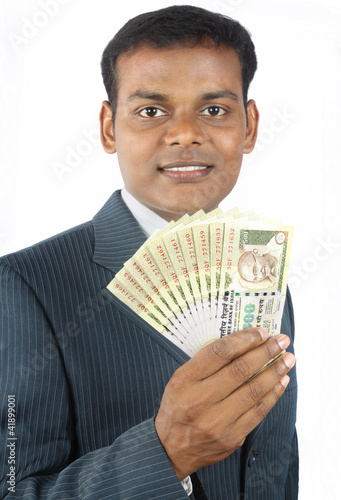 Photo: indian business man holding indian money indian business man holding indian money