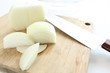 onion slices on wooden cutting board