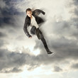 Photo: Cool young man jumping and kicking Cool young man jumping and kicking