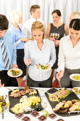 Photo: Company meeting catering business people eating Company meeting catering business people eating