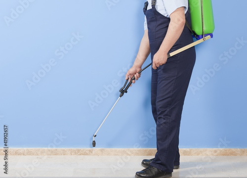 Photo: Man spraying insects- pest control Man spraying insects- pest control