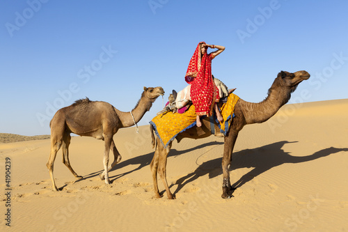 Photo: Woman in saree with her camels, Thar Desert, Rajasthan, India. Woman in saree with her camels, Thar Desert, Rajasthan, India.