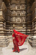 Woman's sari blowing in the wind, Khajuraho Temples, India.