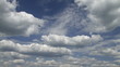 time lapse clip of white fluffy clouds over blue sky