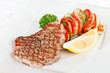 Steak with vegetables on white plate Steak with vegetables on white plate