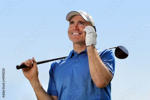 Photo: Golfer using mobile phone Golfer using mobile phone
