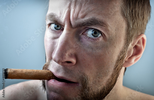 Photo: a man with a cigar a man with a cigar