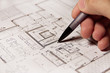 Pencil in hand on building plans