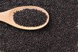 Black cereal on wood spool Black cereal on wood spool